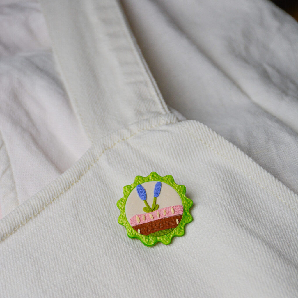 Broche Coin lecture Saboom